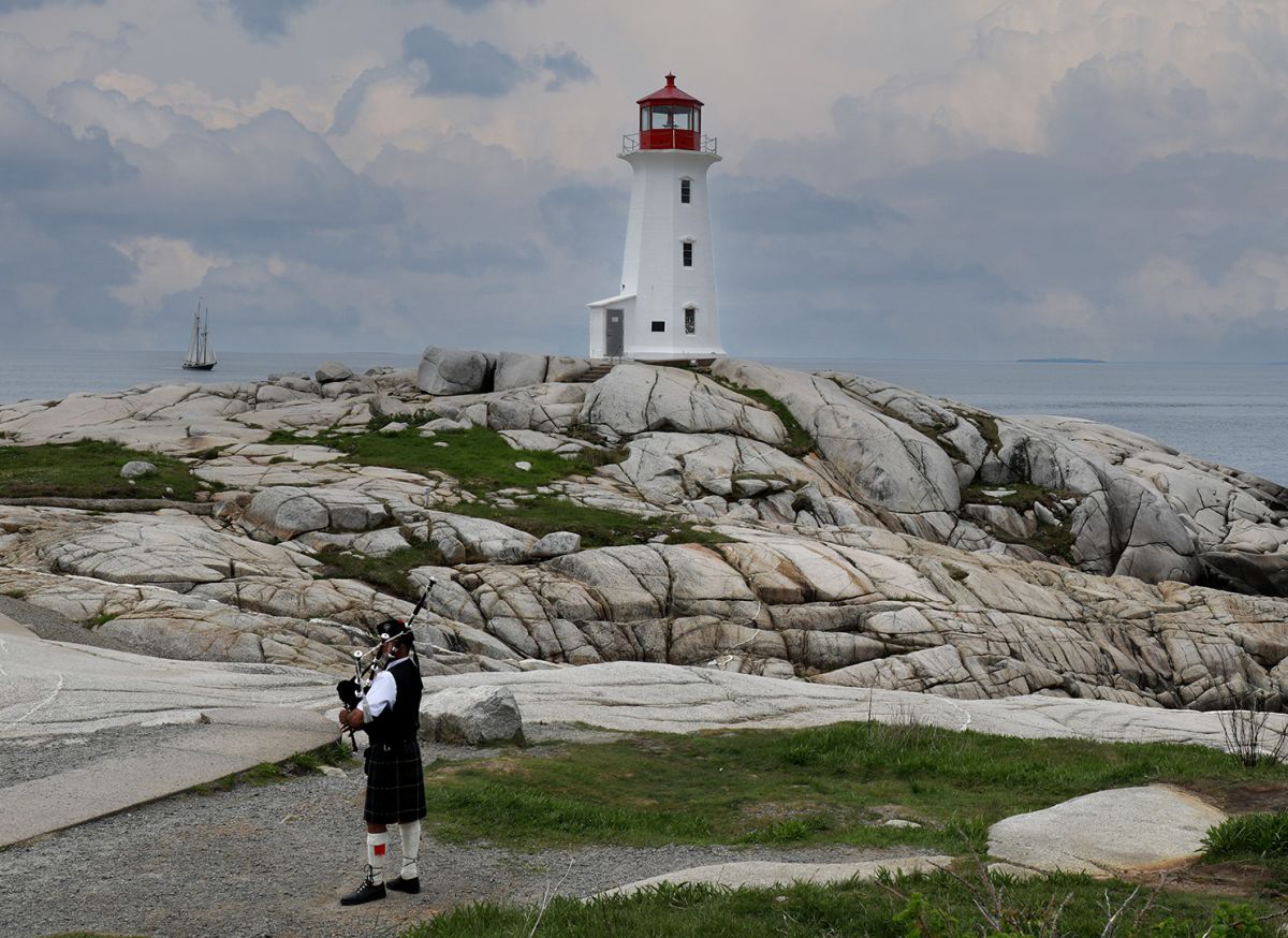 A Lighthouse a Piper and the Bluenose II