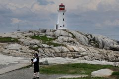 A Lighthouse a Piper and the Bluenose II